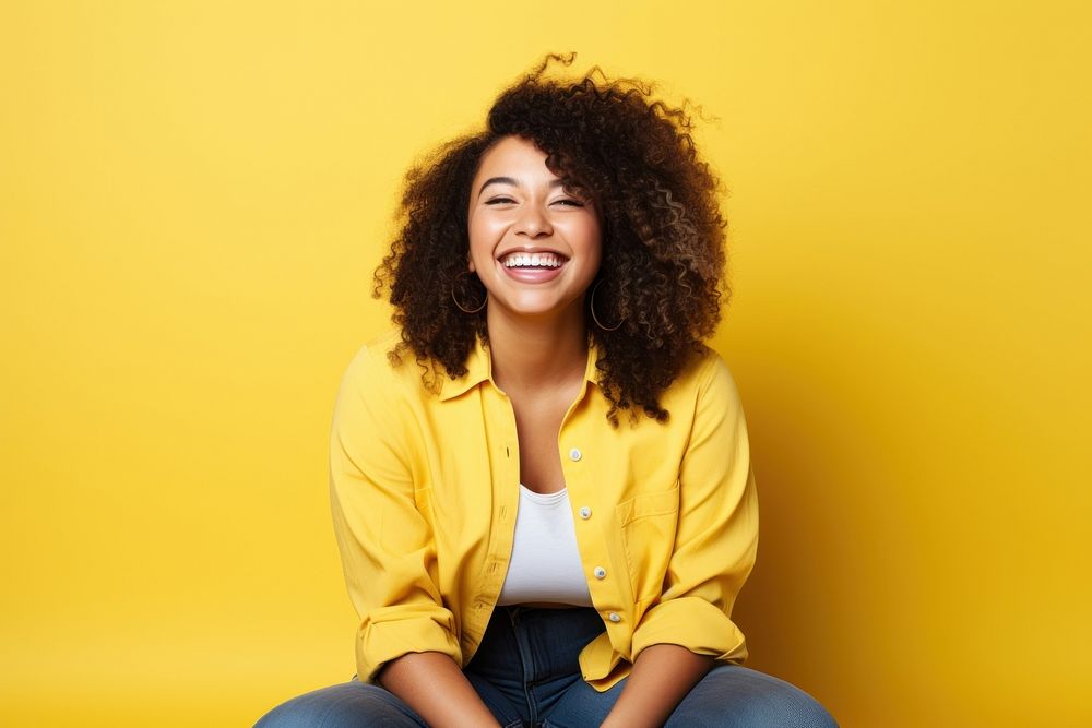 Mixed raced chubby woman sitting smile cheerful yellow. AI generated Image by rawpixel.