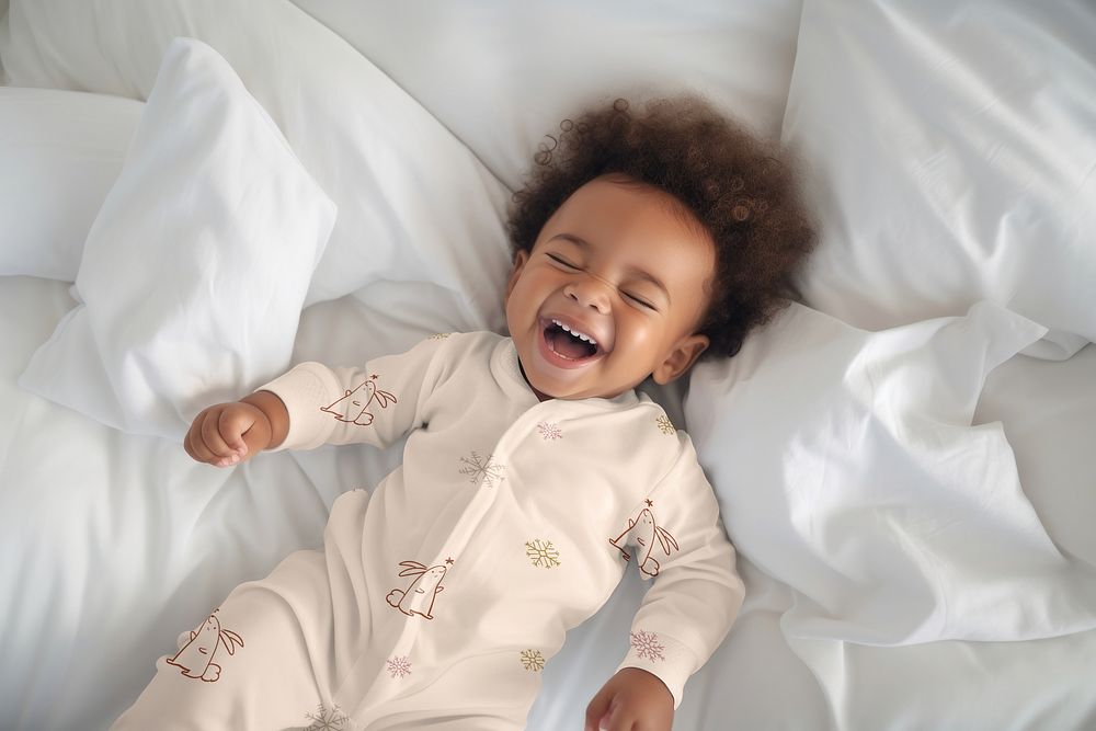 Happy baby on bed