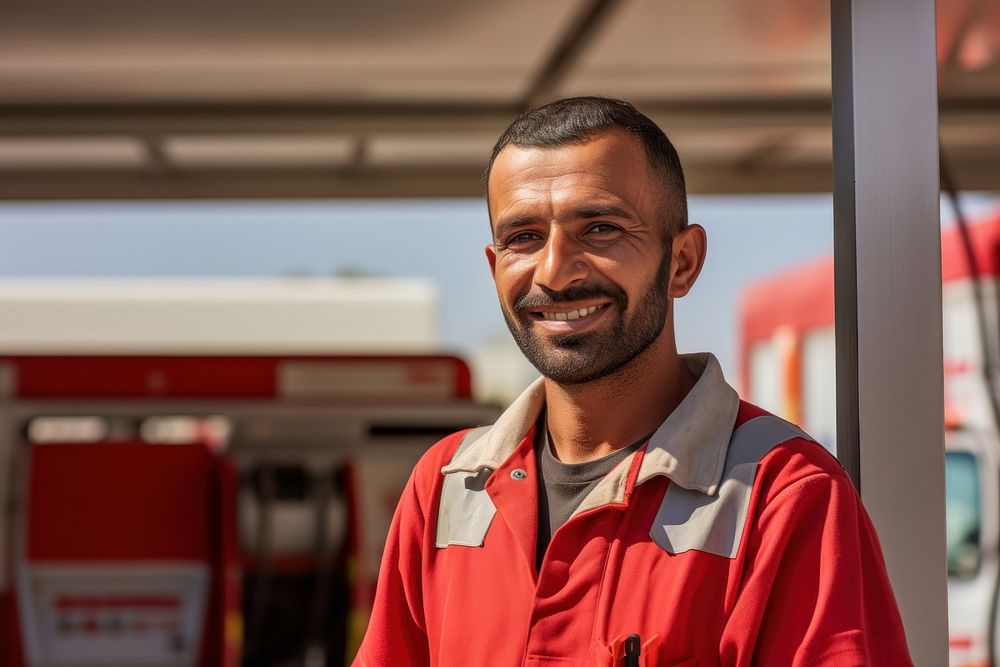 Qatar arab gas station worker working adult smile. AI generated Image by rawpixel.