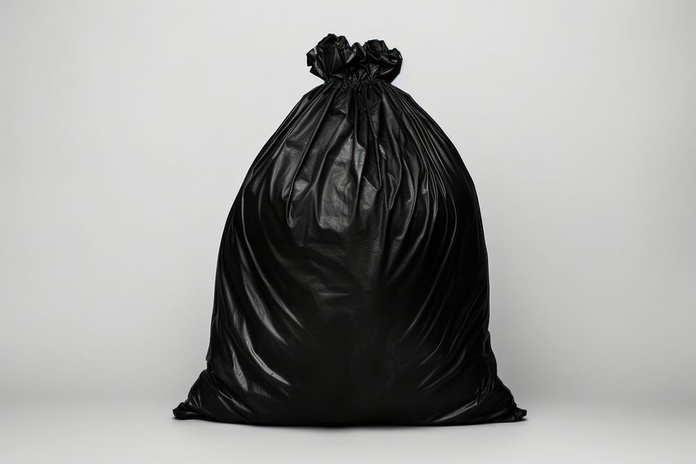 Black garbage bag white background monochrome darkness. AI generated Image by rawpixel.