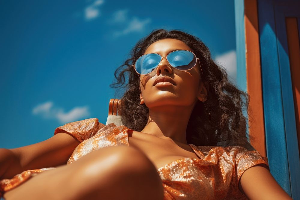Indian woman sunbathing sunglasses summer. AI generated Image by rawpixel.