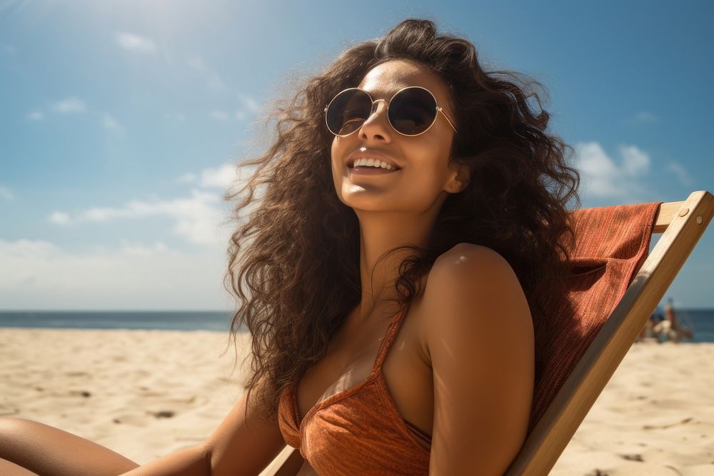 Indian woman sunglasses sunbathing smiling. AI generated Image by rawpixel.