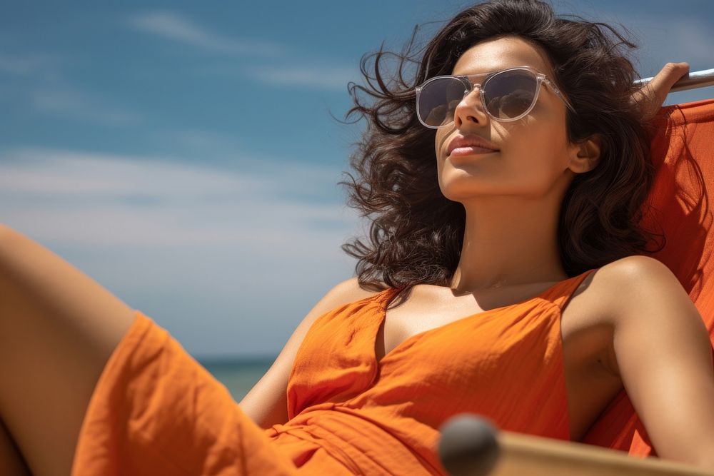Indian woman sunbathing sunglasses summer. AI generated Image by rawpixel.