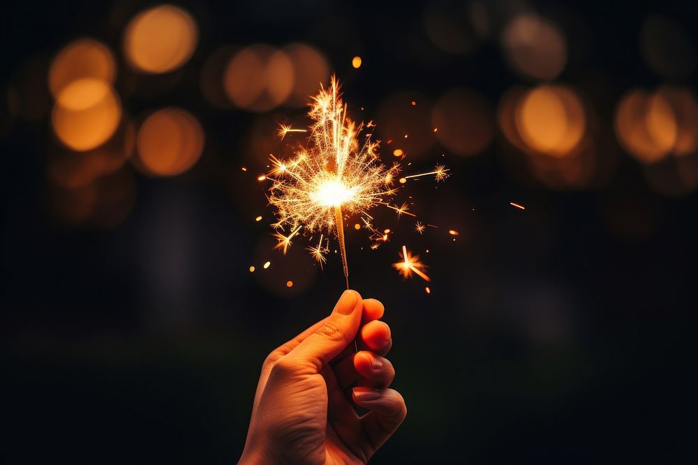 Hand celebration fireworks sparkler. AI generated Image by rawpixel.