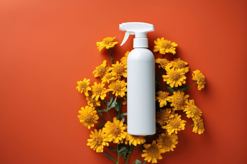 Spray bottle product flower plant asteraceae. AI generated Image by rawpixel.