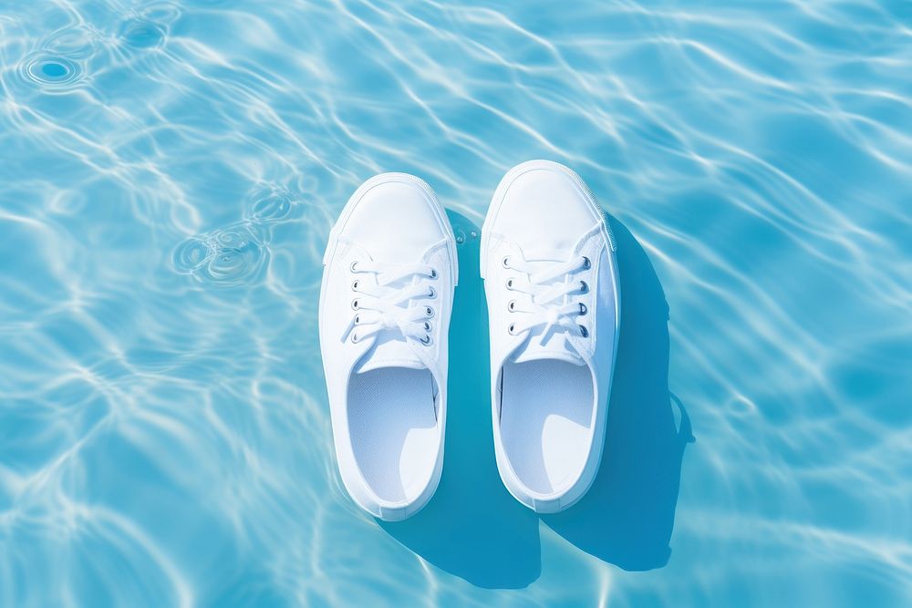 White sneakers product footwear water shoe. AI generated Image by rawpixel.
