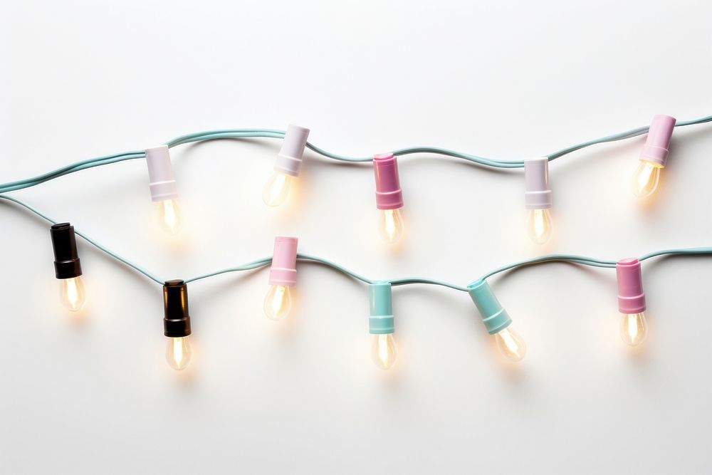 Christmas lights string white background illuminated electricity. AI generated Image by rawpixel.