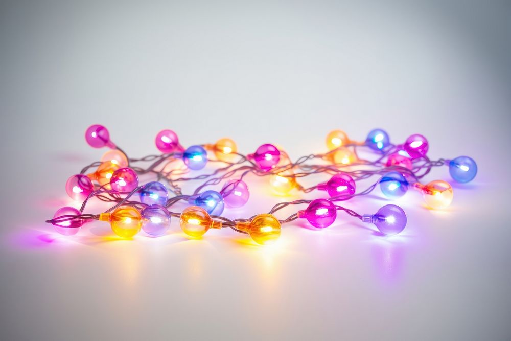 Color fairy lights jewelry illuminated celebration. AI generated Image by rawpixel.