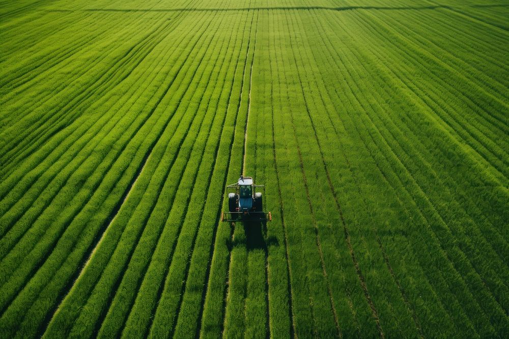 Tractor mowing green field outdoors nature farm. AI generated Image by rawpixel.