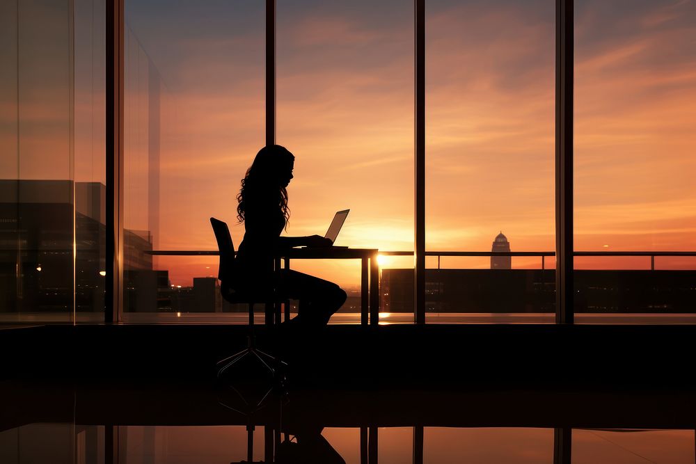Businesswoman laptop sitting sunset. AI generated Image by rawpixel.
