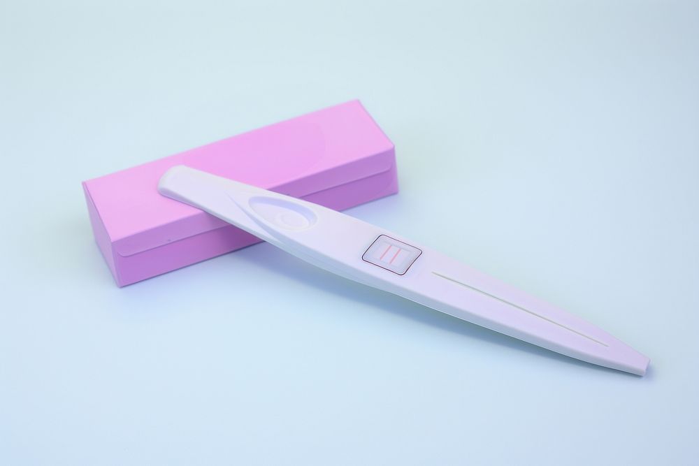 A pregnancy test kit showing positive result blade thermometer weaponry. AI generated Image by rawpixel.
