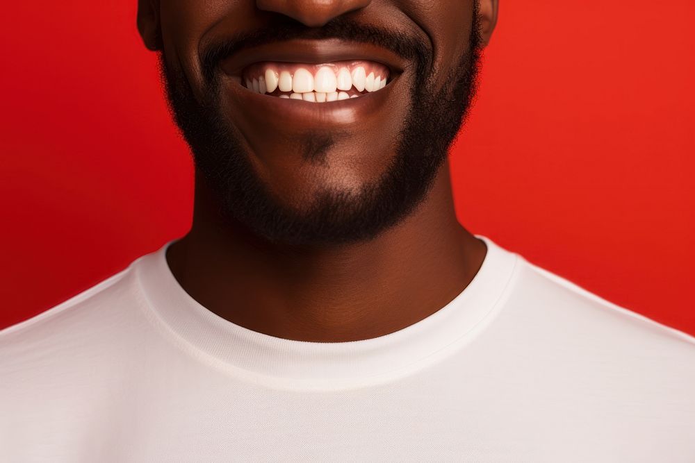 Micro shot of a smiling mouth on a red background teeth beard adult. AI generated Image by rawpixel.