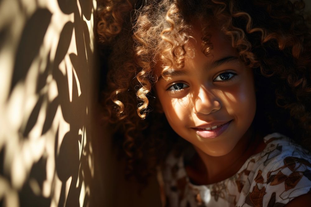 Micro shot of a smiling young african american girl photography portrait shadow. AI generated Image by rawpixel.