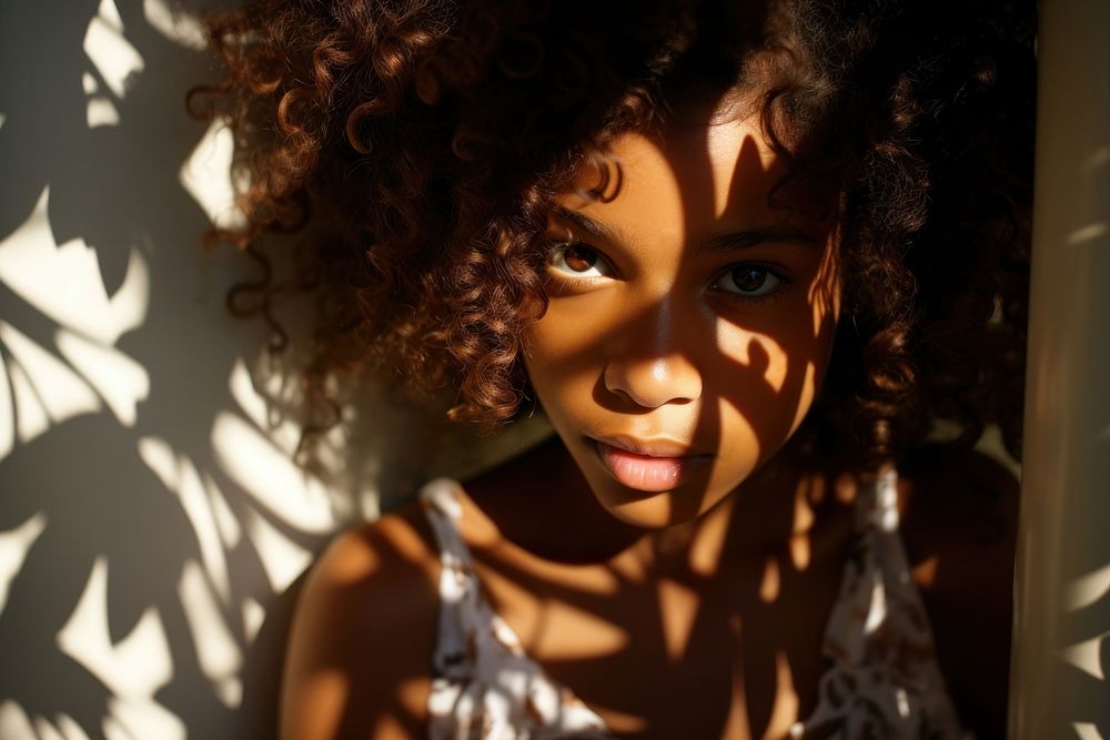 Smiling young african american girl photography portrait shadow. AI generated Image by rawpixel.