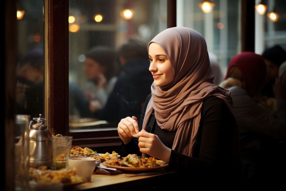 Women wearing hijabs restaurant eating adult. AI generated Image by rawpixel.