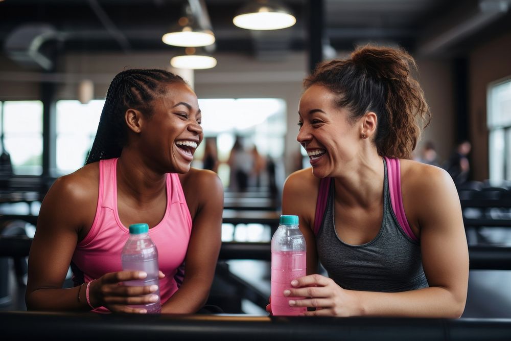 Sportive women laughing drinking sports. AI generated Image by rawpixel.