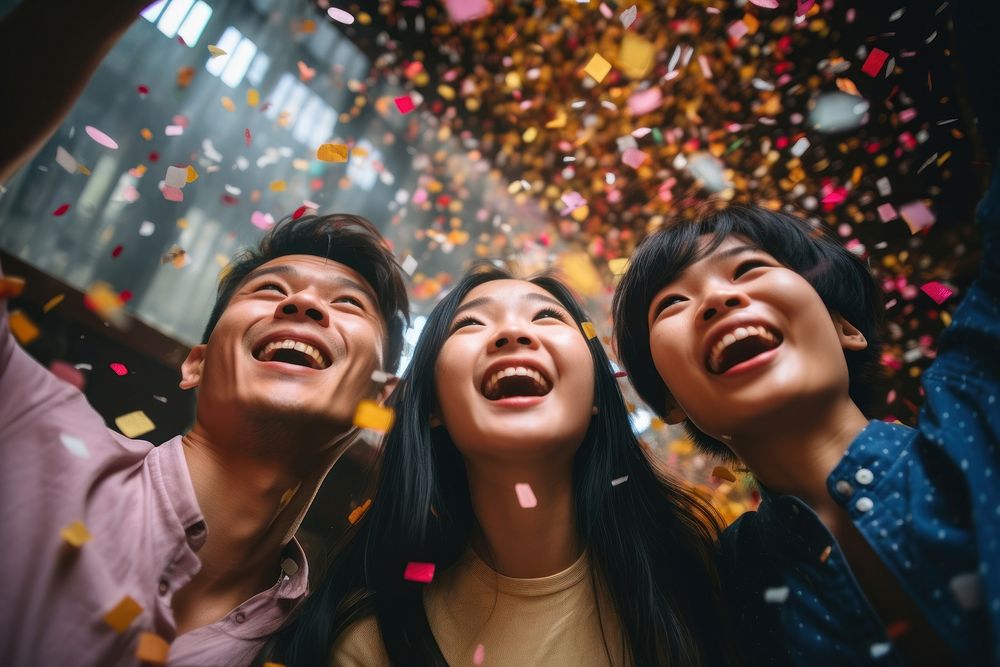 Asian university students celebrating laughing confetti. AI generated Image by rawpixel.