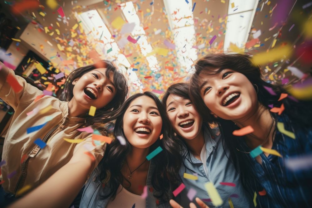 Asian university students celebrating laughing confetti. AI generated Image by rawpixel.