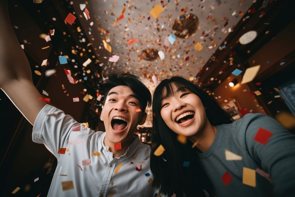 Asian university students celebrating laughing confetti. AI generated Image by rawpixel.