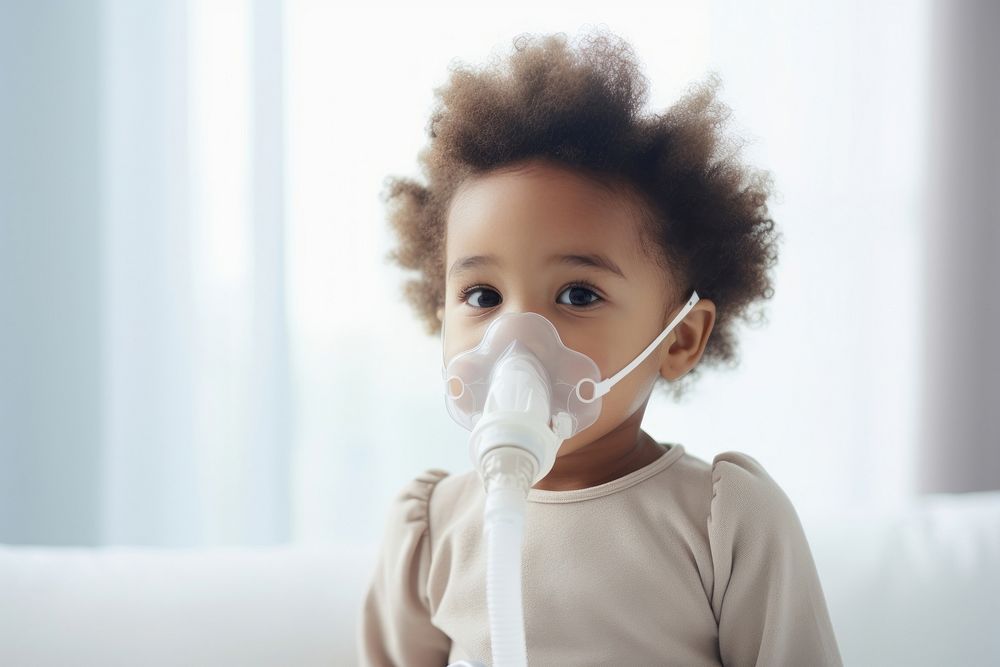African baby girl use nebulizer mask innocence pollution portrait. AI generated Image by rawpixel.