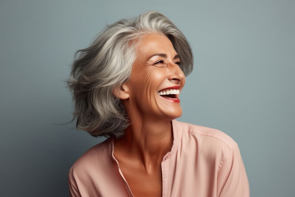 Senior Cuban woman laughing portrait smiling. AI generated Image by rawpixel.