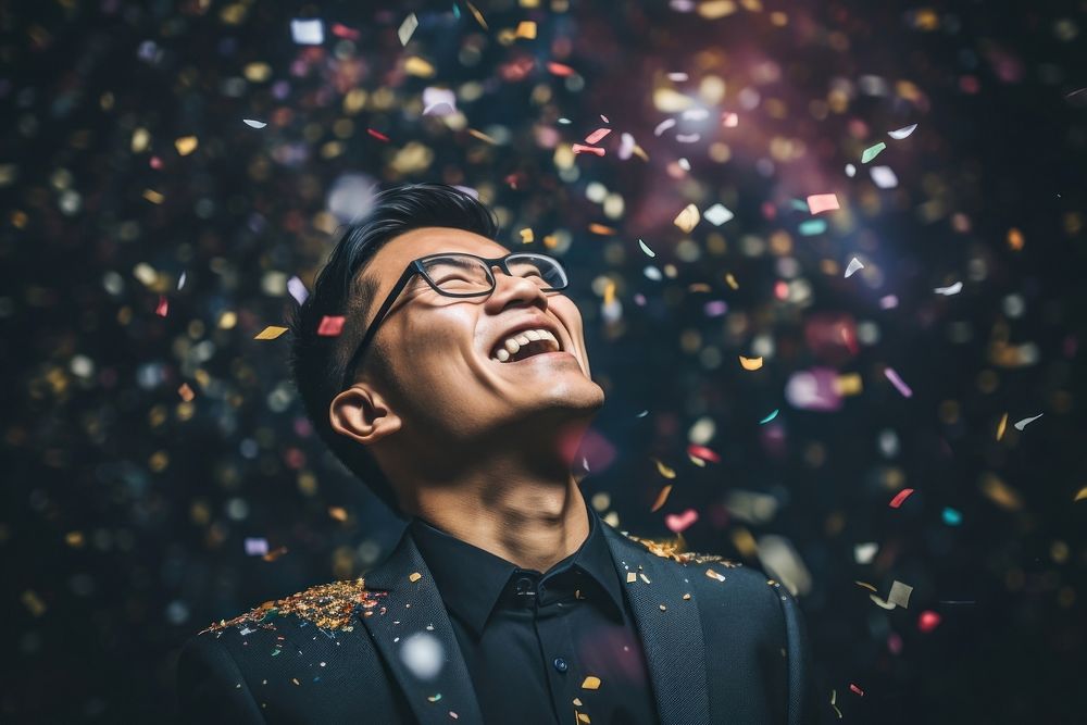 Asian american man confetti laughing adult. AI generated Image by rawpixel.