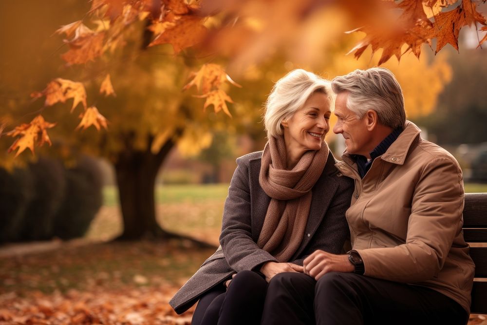 Middle-aged couple autumn portrait sitting. AI generated Image by rawpixel.