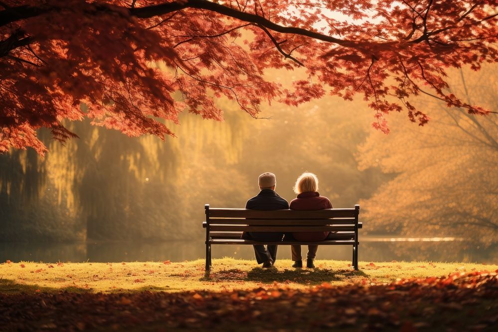 Middle-aged couple sitting autumn bench. AI generated Image by rawpixel.