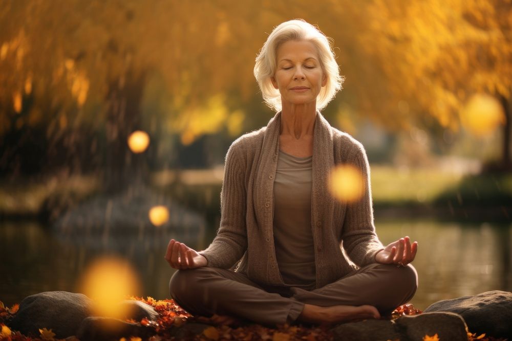 Senior woman sitting autumn adult. AI generated Image by rawpixel.