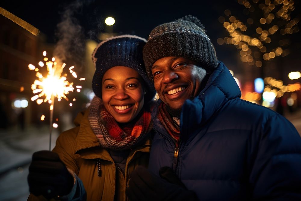 Couple holding glow sticks outdoors portrait winter. AI generated Image by rawpixel.