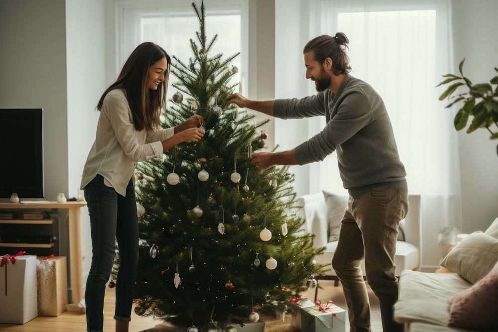Couple decorating christmas tree adult love man. AI generated Image by rawpixel.