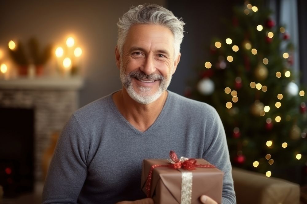 Christmas gift smiling adult man. AI generated Image by rawpixel.