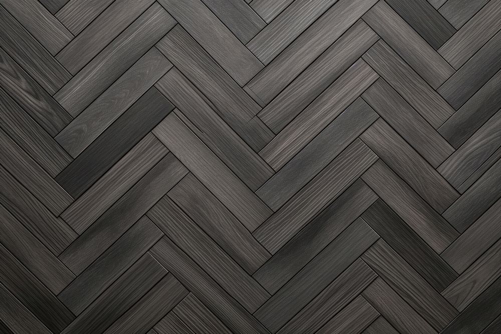 Dark grey herring bone parquet wood backgrounds flooring. 