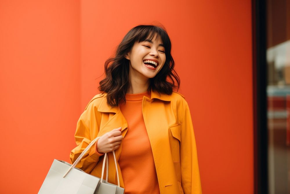 Happy asian american women holding shopping bag laughing smile adult. AI generated Image by rawpixel.