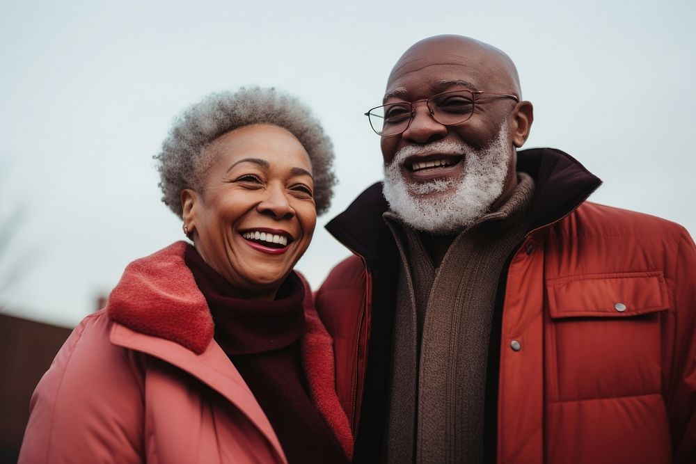 Happy black senior couple wearing a winter jacket laughing adult togetherness. AI generated Image by rawpixel.