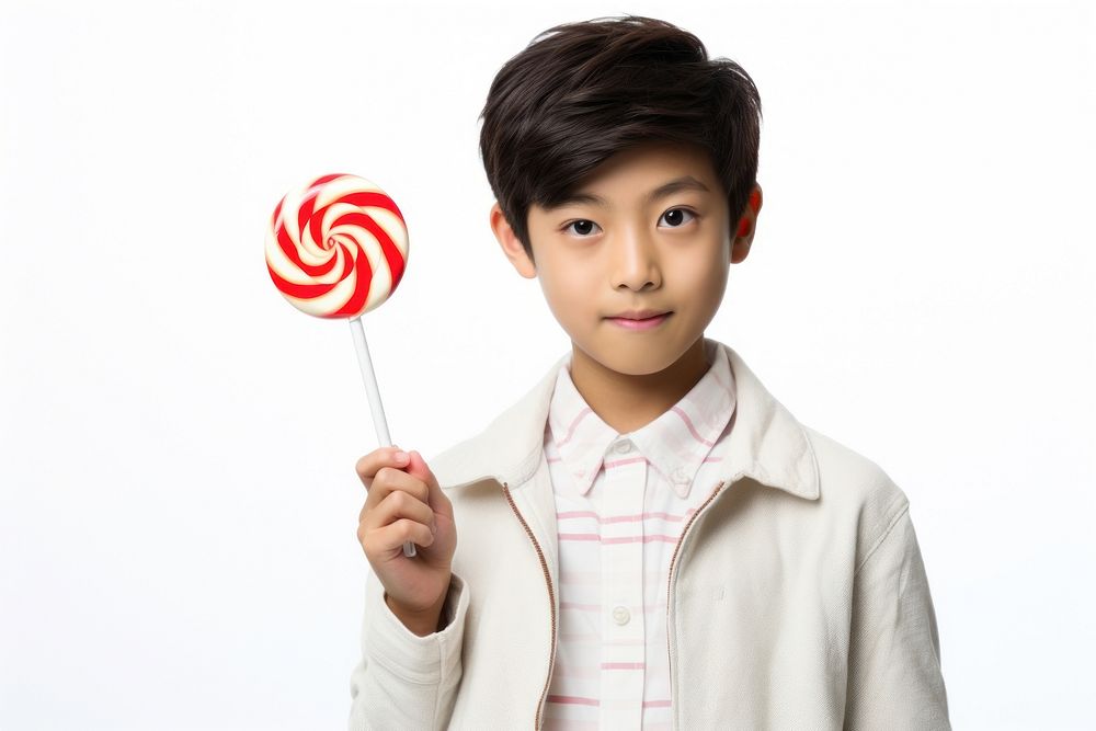 Boy holds lolipop lollipop candy child. AI generated Image by rawpixel.