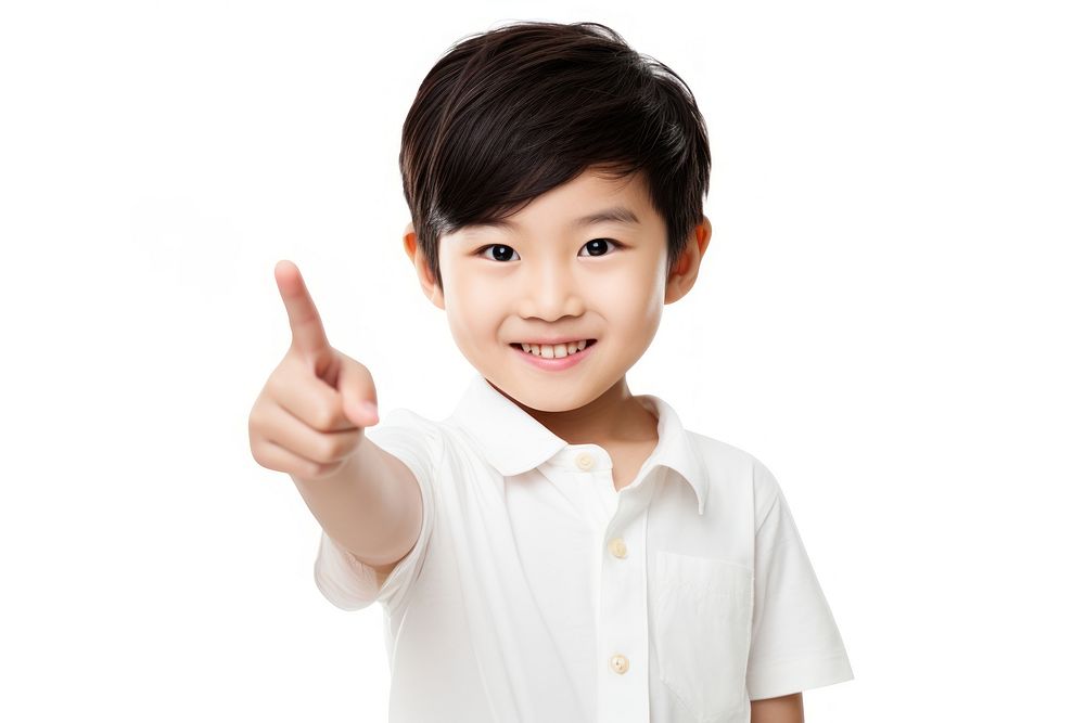Asian boy smiling finger pointing portrait. AI generated Image by rawpixel.
