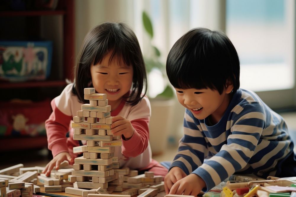 Asian kids building blocks child togetherness construction. AI generated Image by rawpixel.