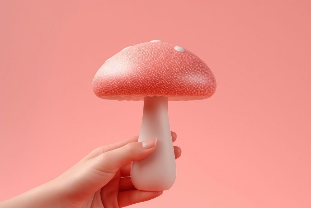 Mushroom holding fungus agaric. AI generated Image by rawpixel.