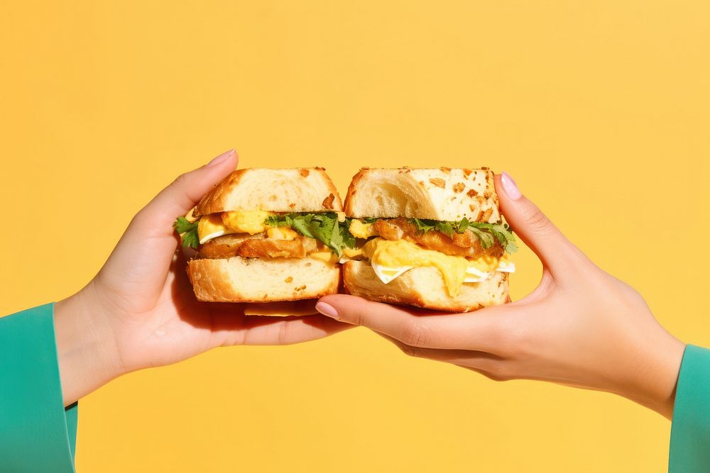 Egg sandwiches holding bread food. AI generated Image by rawpixel.