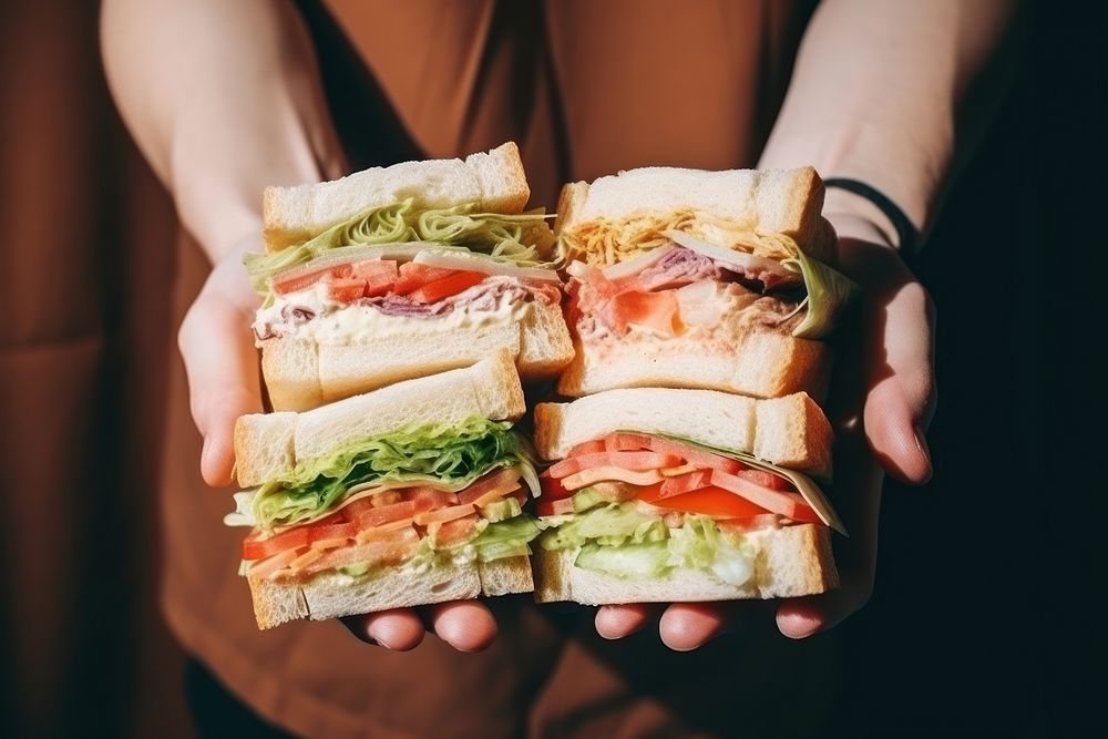 Sandwiches holding bread food. AI generated Image by rawpixel.