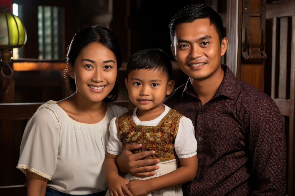 South east asian family smiling adult. AI generated Image by rawpixel.