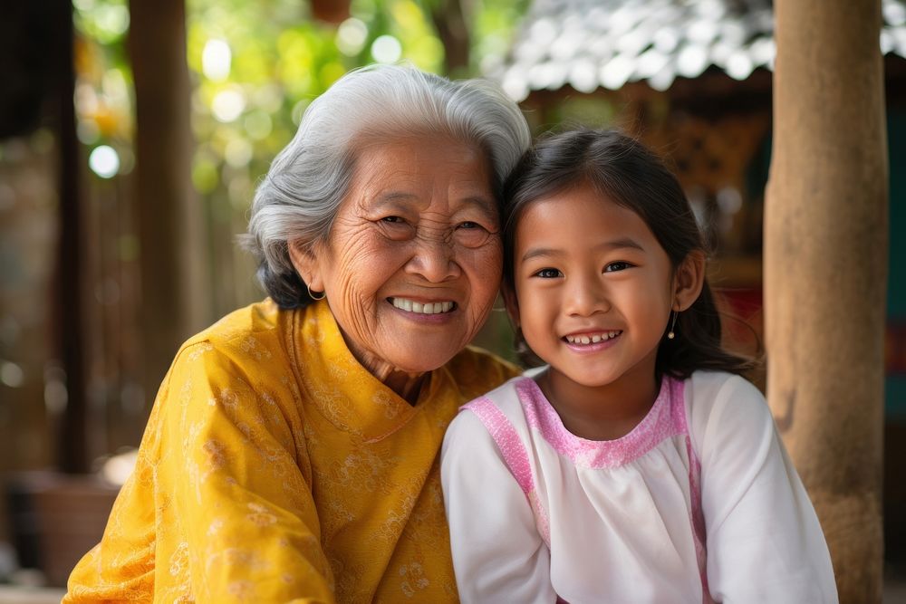 South east asian grandmother smiling adult. AI generated Image by rawpixel.