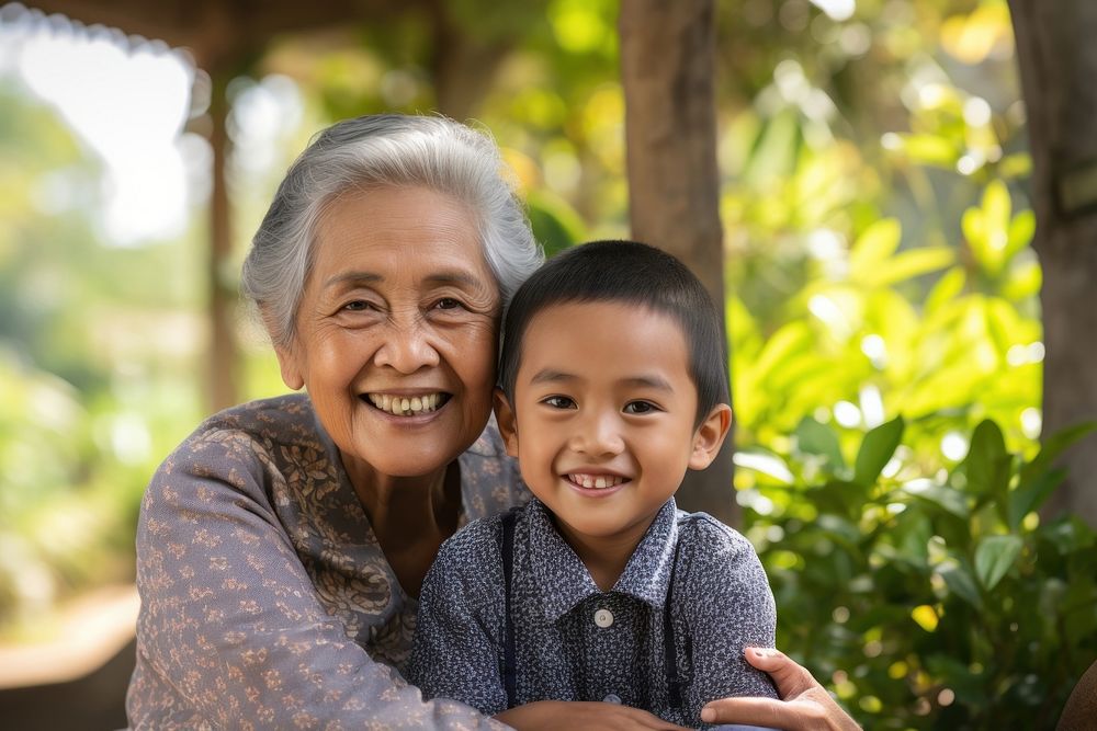 South east asian grandmother smiling family. AI generated Image by rawpixel.