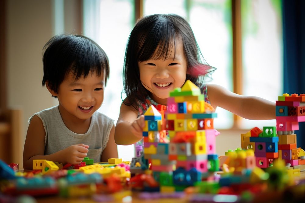 South east asia Children Playing With colorful Toy Blocks child toy togetherness. AI generated Image by rawpixel.
