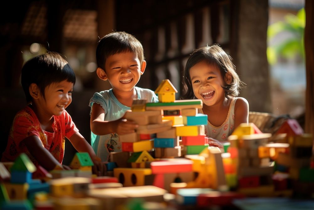 South east asia Children Playing With colorful Toy Blocks child play toy. AI generated Image by rawpixel.