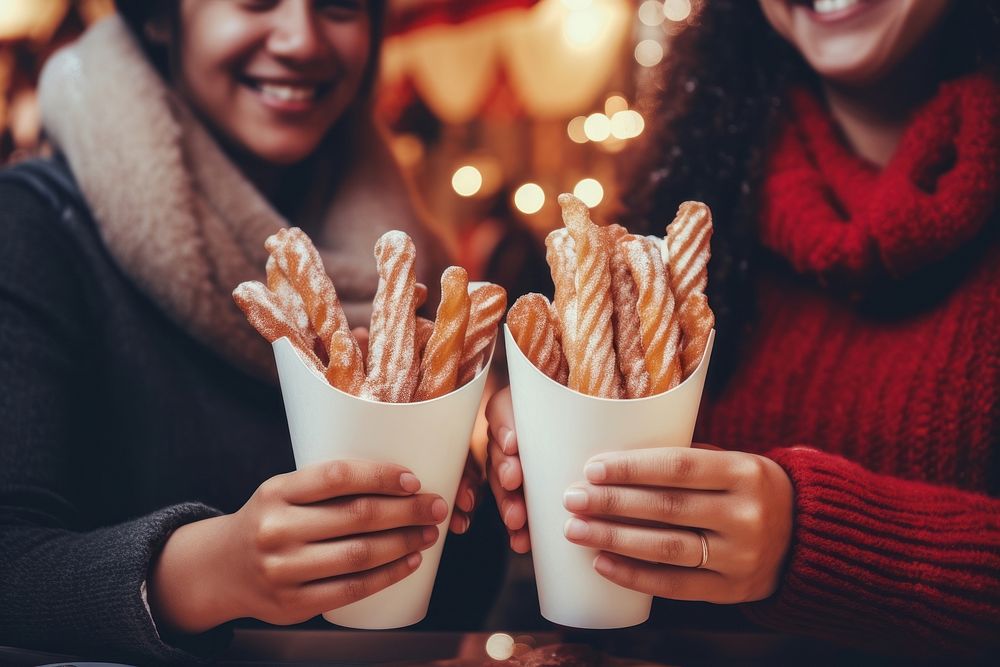 Churros christmas holding food. AI generated Image by rawpixel.