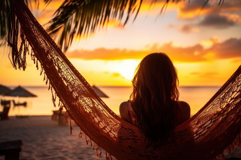 Young woman relaxing vacation beach outdoors. AI generated Image by rawpixel.