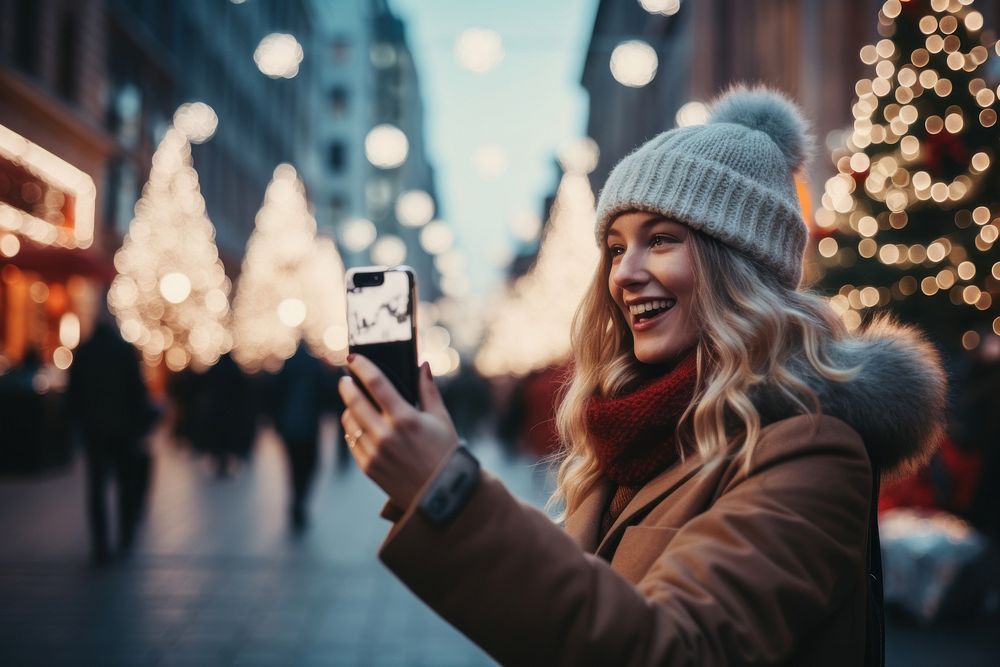 Woman taking photo christmas selfie adult. AI generated Image by rawpixel.
