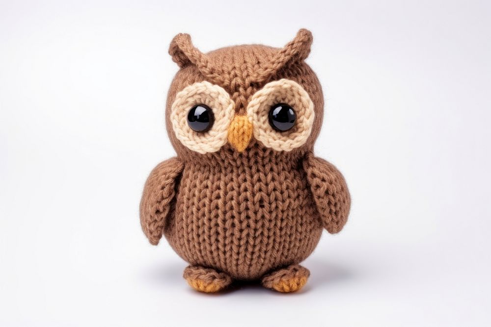 Knitted cute toy owl white background representation. 